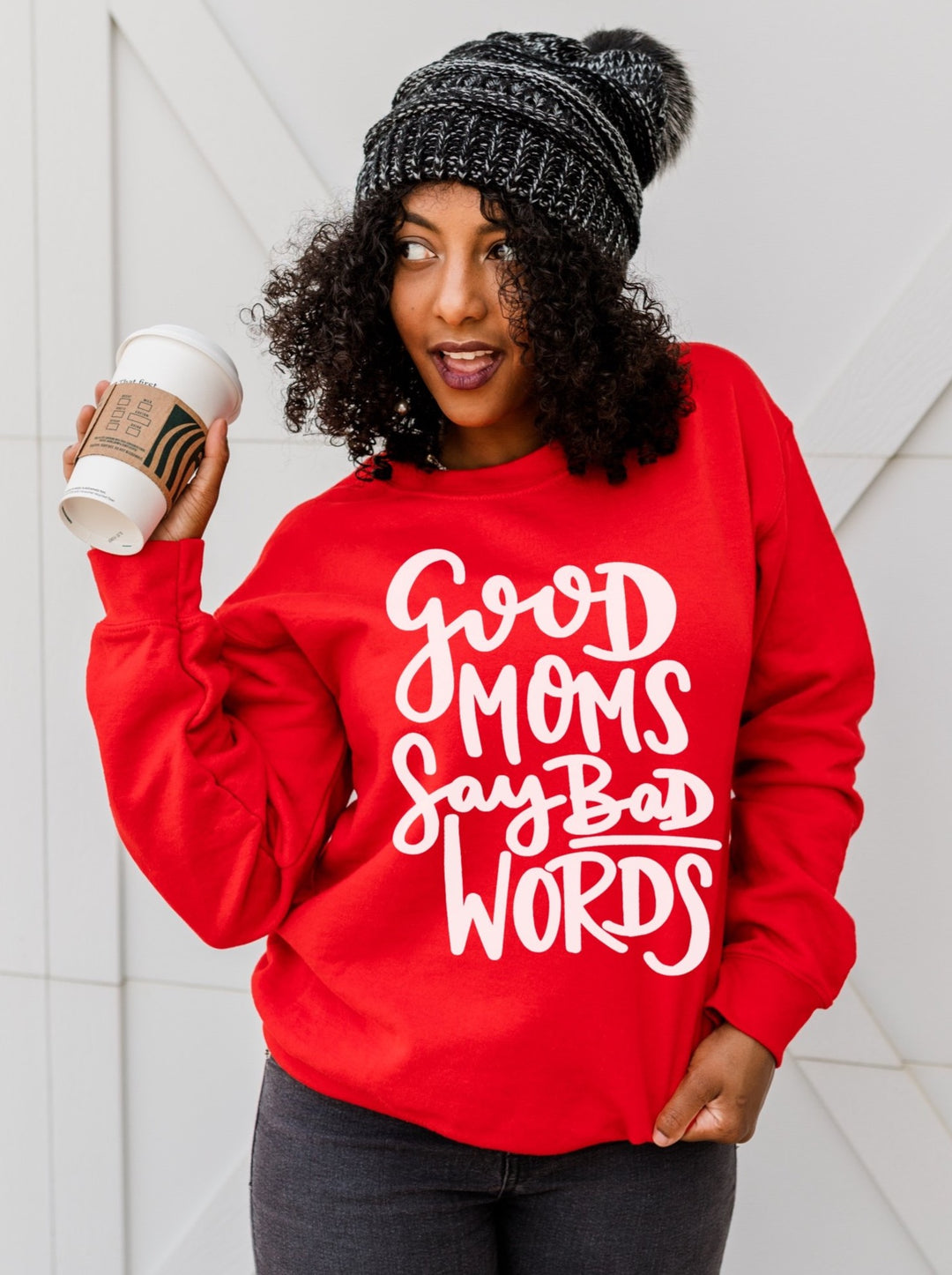 Red sweatshirt with white lettering that says good moms say bad words